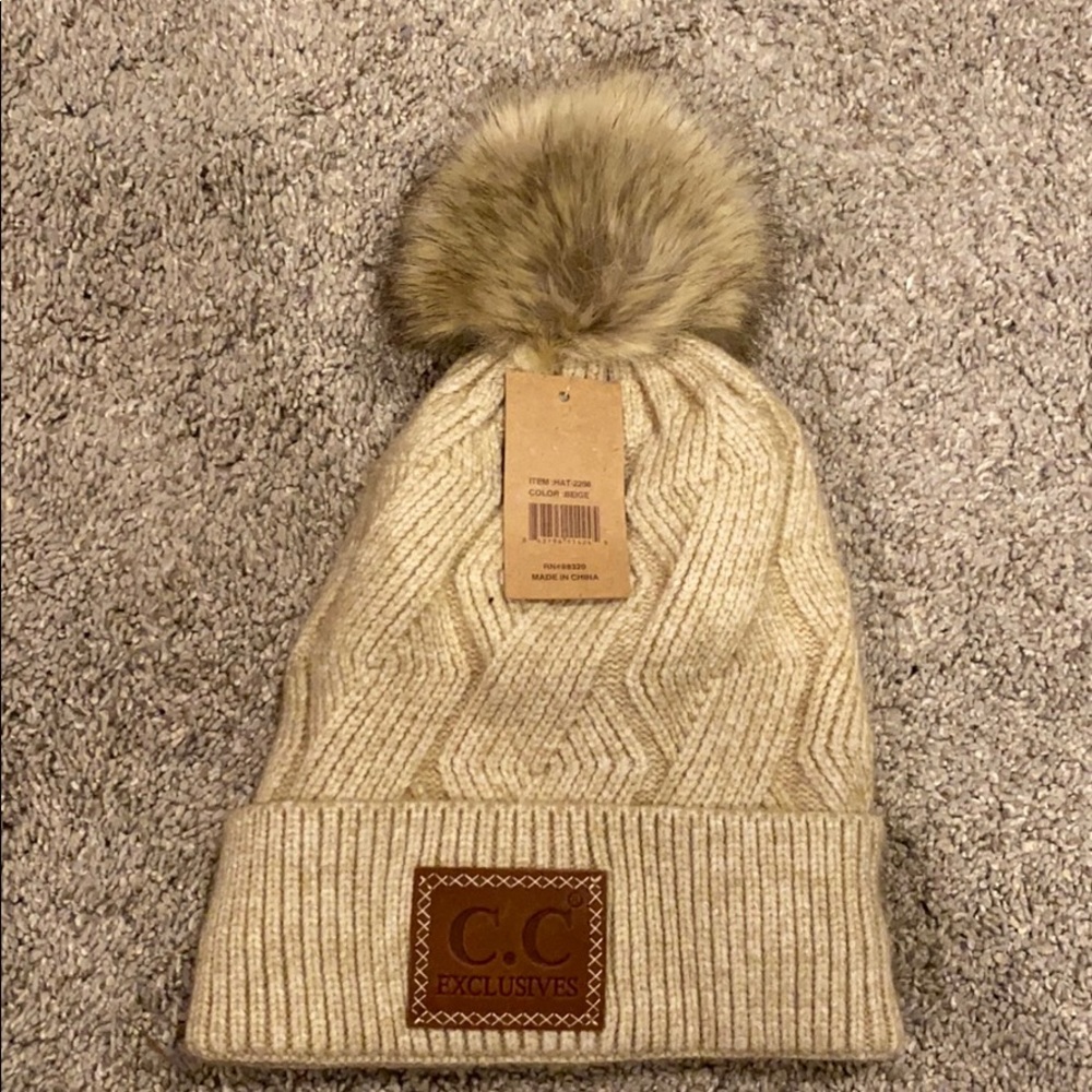 Selling CC beanie with puff ball!